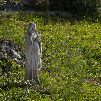 weathered statue of Mary