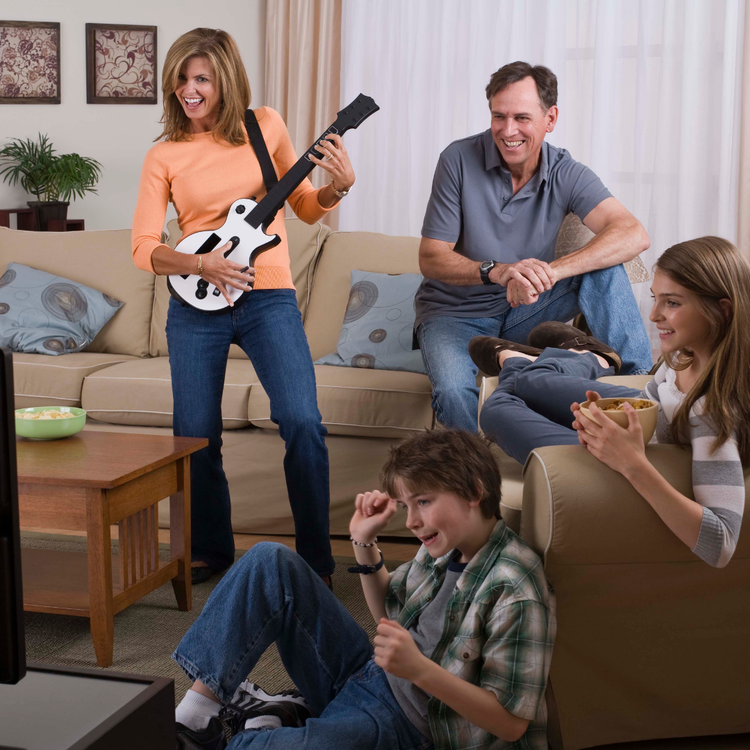 family playing Guitar Hero