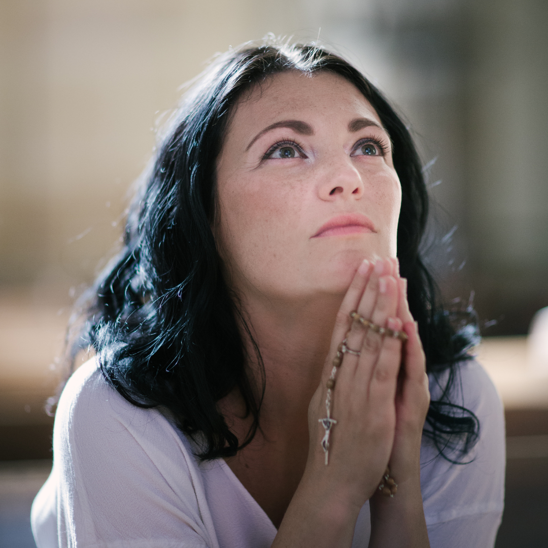 woman praying the Rosary